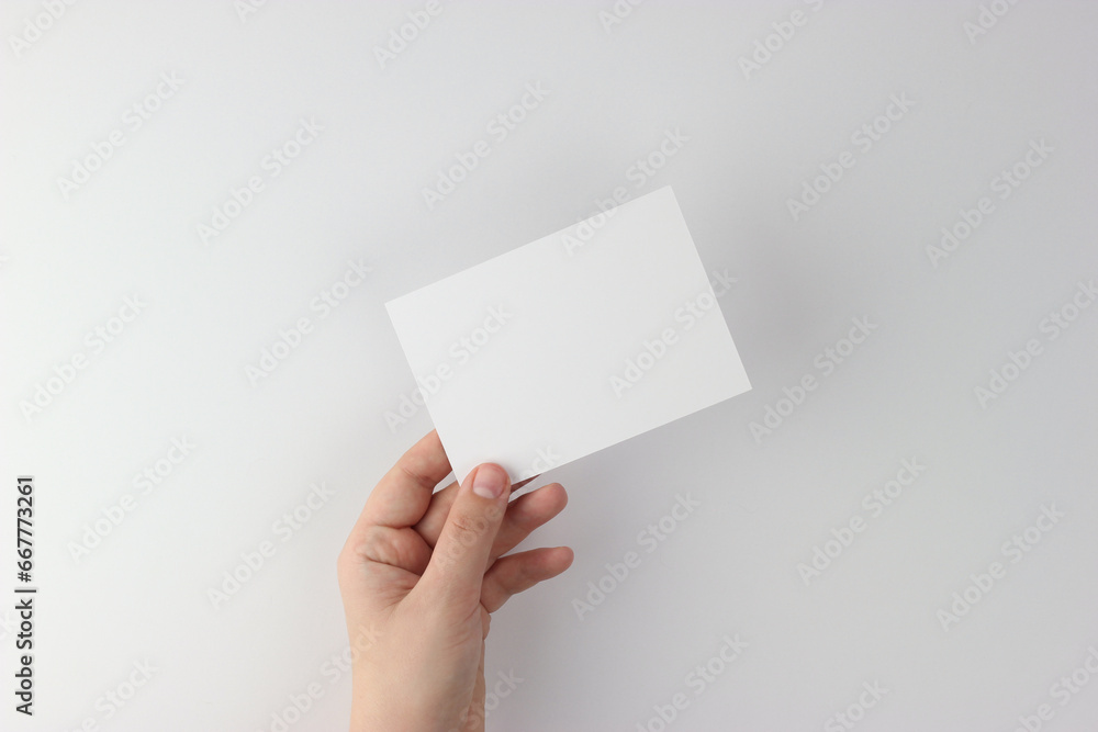 Card mockup in minimalist style, blank card in hand Card mockup in minimalist style, blank card in hand