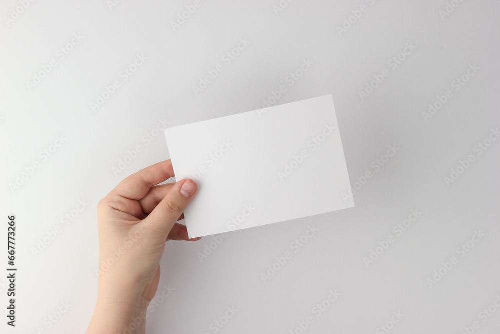 Card mockup in minimalist style, blank card in hand Card mockup in minimalist style, blank card in hand