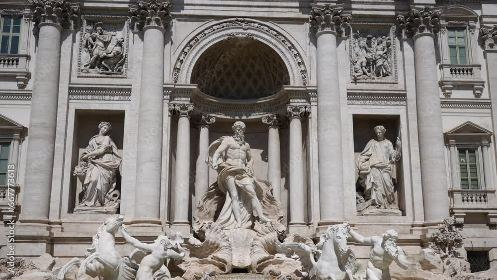 Scenic wide shot view of Trevi water fountain and sculpture building, ancient baroque architecture of Palazzo palace Polio on sunny day. One of most famous destination in Rome. Shooting in slow motion Scenic wide shot view of Trevi water fountain and sculpture building, ancient baroque architecture of Palazzo palace Polio on sunny day. One of most famous destination in Rome. Shooting in slow motion