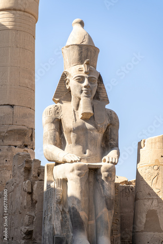 Stone statues of the Luxor Temple in ancient Thebes  Egypt  built under the 18th and 19th Egyptian dynasties  during a sunny day