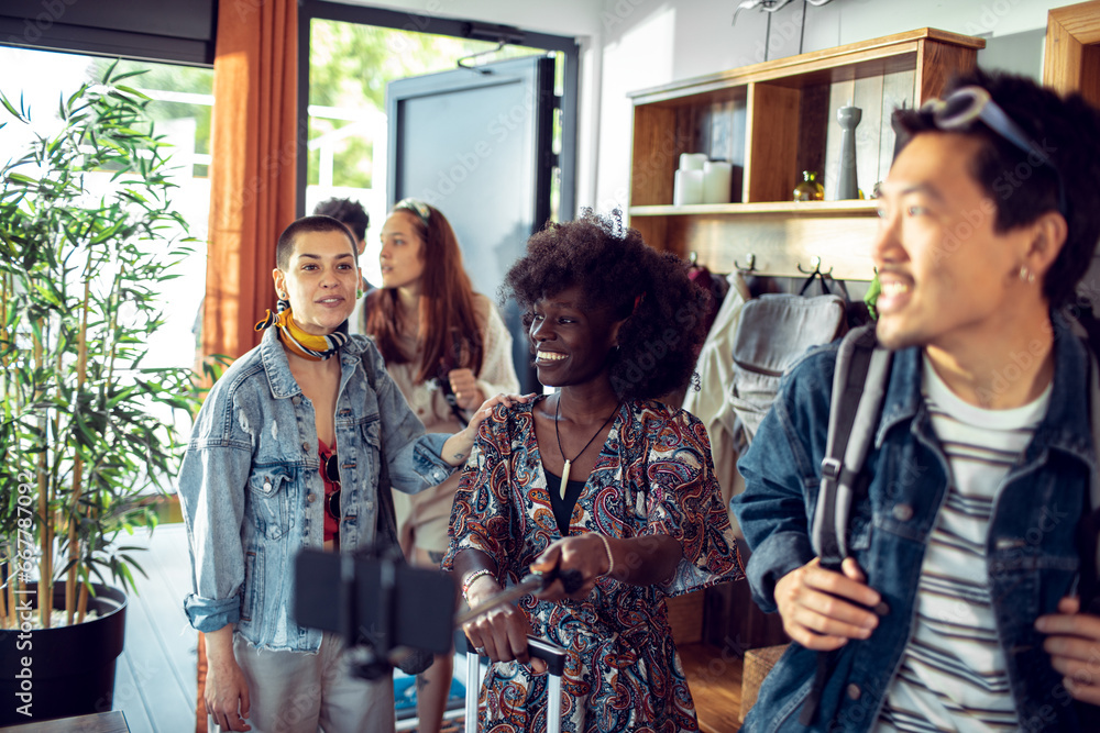 Diverse Friends Sharing Lighthearted Moments in a Sunlit Room Diverse Friends Sharing Lighthearted Moments in a Sunlit Room
