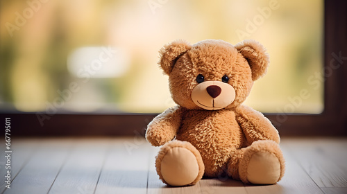 Cute Teddy Bear Sitting by Sunlit Window with Warm Background © John