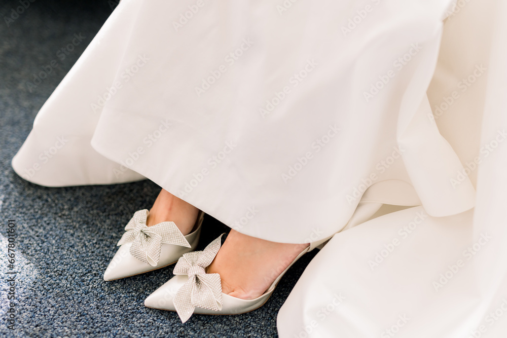 brides feet in white heels