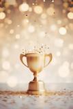 Golden champion cup  with sparkling lights on bokeh background 