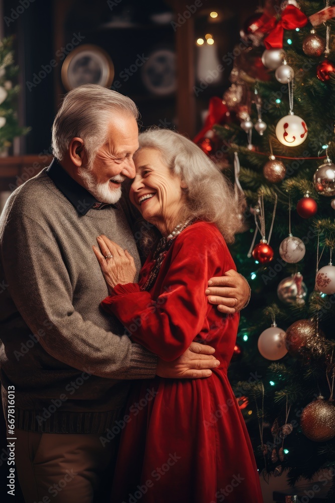Old man and woman are decorating Christmas tree, grandparents are hugging against the background of the New Year tree, New Year and Christmas Old man and woman are decorating Christmas tree, grandparents are hugging against the background of the New Year tree, New Year and Christmas