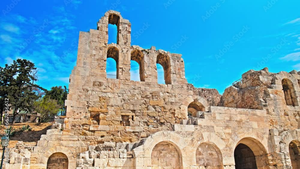 A stone Roman theatre structure of Odeon of Herodes Atticus in Athens. Historical and architectural building in Acropolis of Athens, Greece. A stone Roman theatre structure of Odeon of Herodes Atticus in Athens. Historical and architectural building in Acropolis of Athens, Greece.