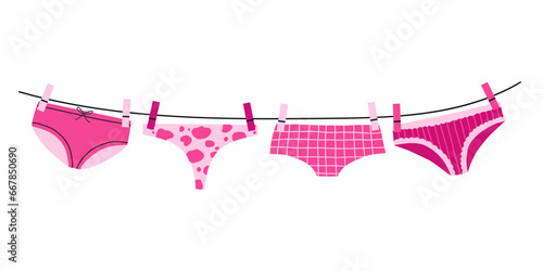 Underwear on rope. Girly lingerie. Washing and drying outdoors. Underpants attached with clothespins to laundry cord.