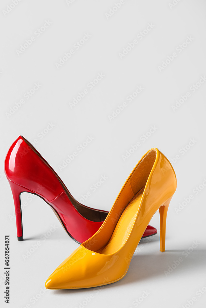 Different stylish high heels on white background Different stylish high heels on white background