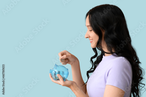 Pretty young woman putting ...