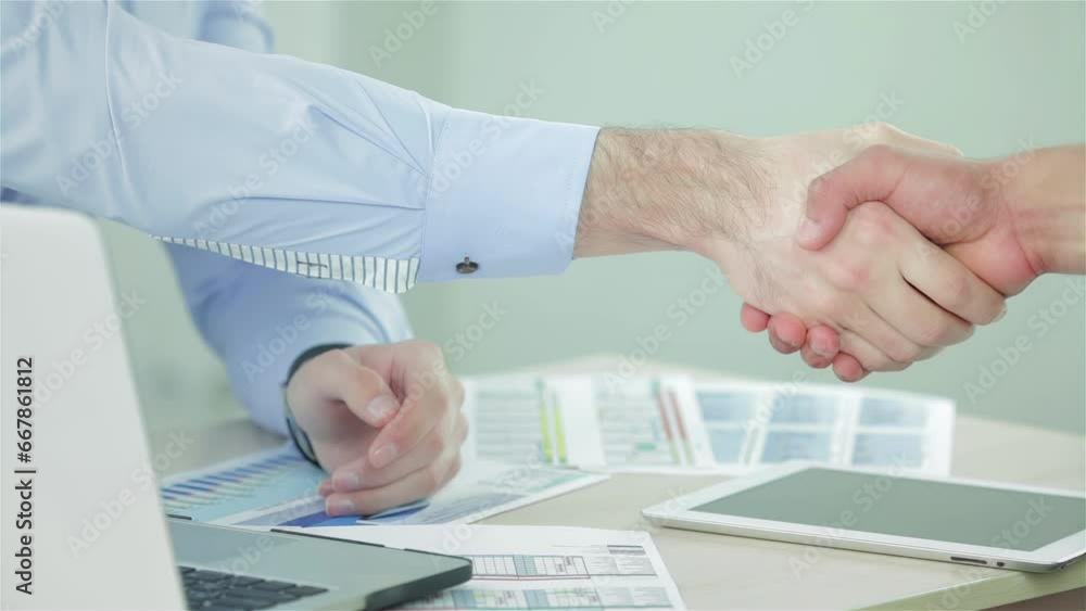Two businessman shaking hands greeting each other Two businessman shaking hands greeting each other