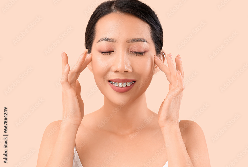 Beautiful Asian woman on beige background, closeup Beautiful Asian woman on beige background, closeup