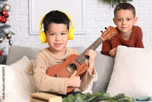 Cute little boys playing gu...