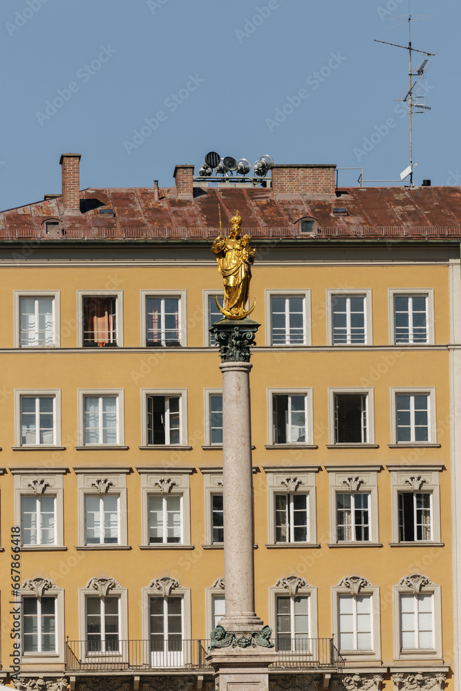 A towering column in Marienplatz, topped by a statue of the Virgin Mary