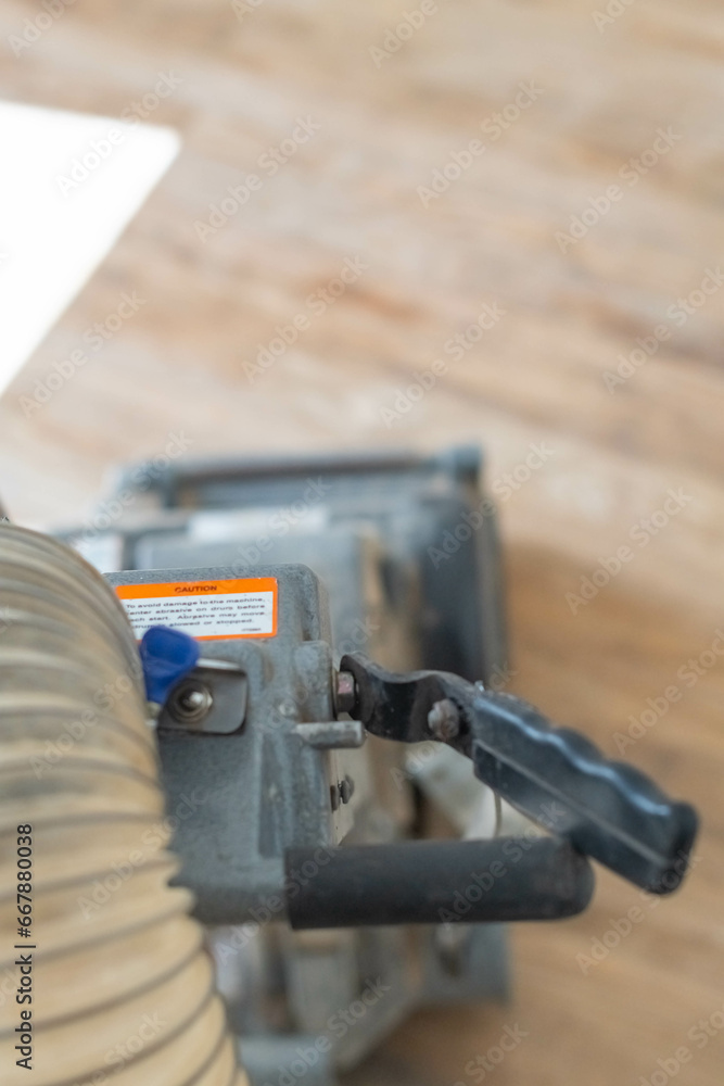 Wooden floor sanding machine, copy space, home renovation theme Wooden floor sanding machine, copy space, home renovation theme