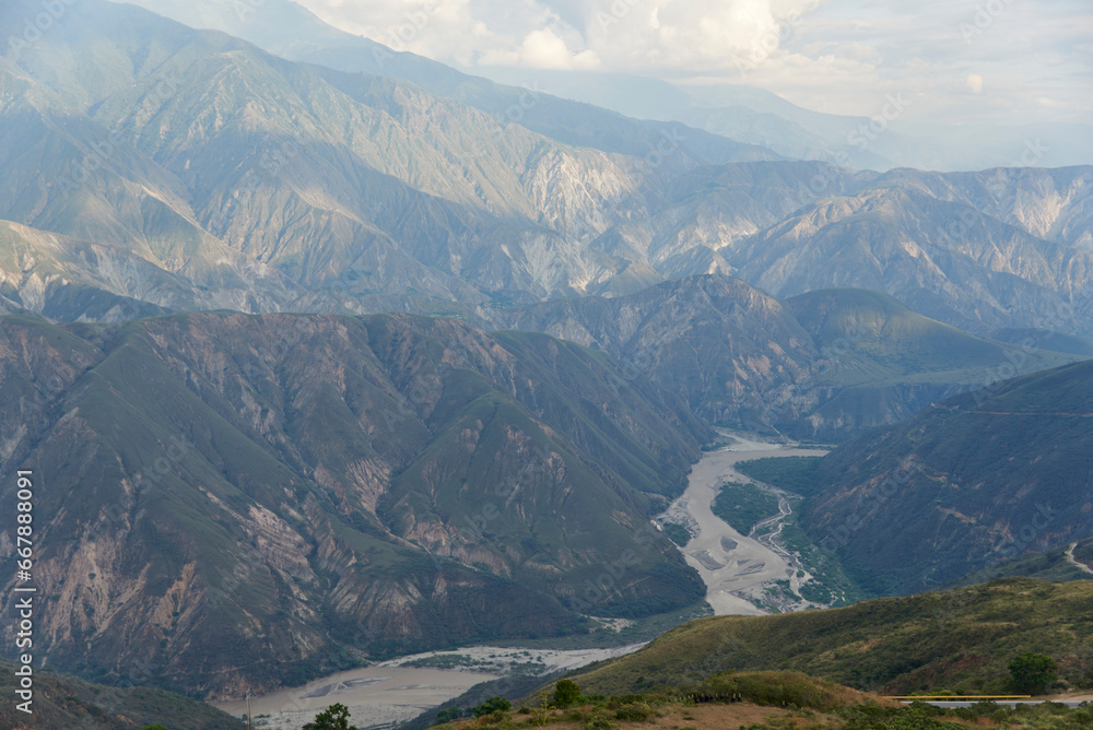 Chicamocha river flowing through a large canyon, mountainous landscape of the Colombian Andes, in Santander, Colombia.