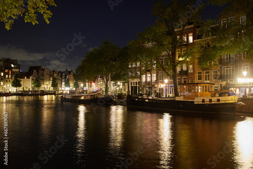 Majestic Amsterdam at night. Summer city landscape. Panorama