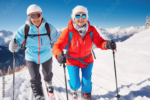 Happy retired couple skiing with ski poles in winter forest, displaying joy, embodying a healthy, retired lifestyle. Active senior couple on winter holidays.