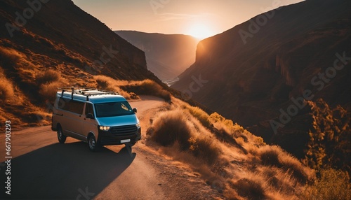 Nature road trip: Van traveling through canyon at sunset, journey to adventure and freedom © ibreakstock