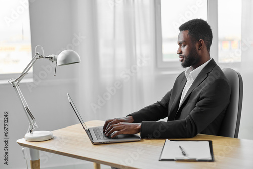 african man office computer education job online laptop american young freelancer student