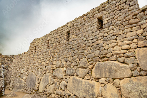 Machu Picchu stone wall of a house inside the ancient city. 