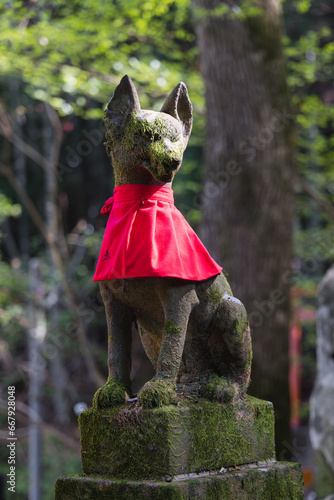 Fox statue at Fushimi Inari Shrine, Kyoto District, Japan photo