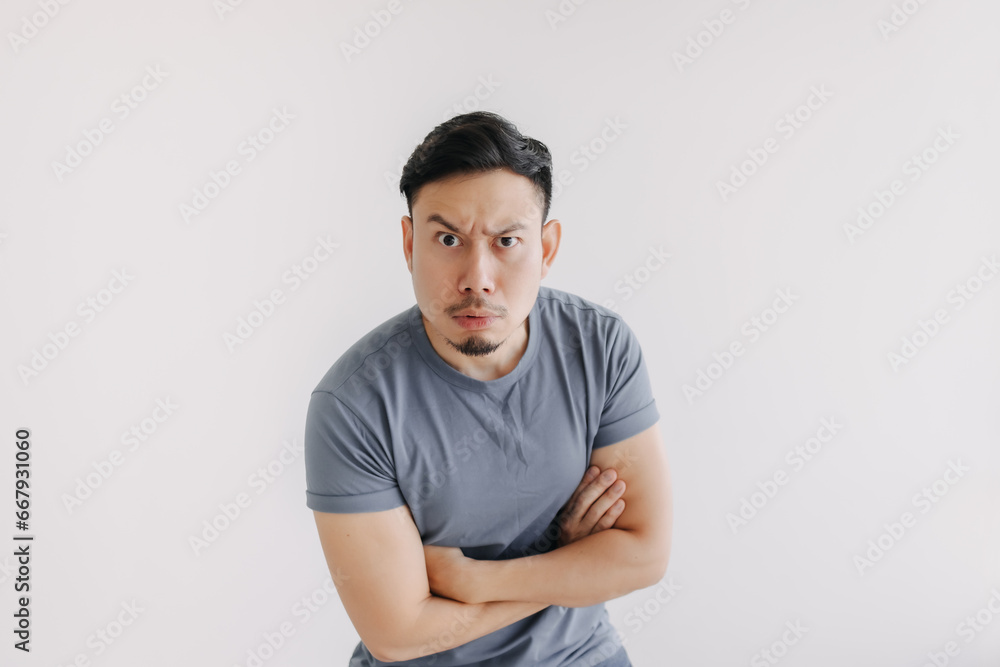 Confused face of asian man in blue t-shirt stand isolated on white. Confused face of asian man in blue t-shirt stand isolated on white.