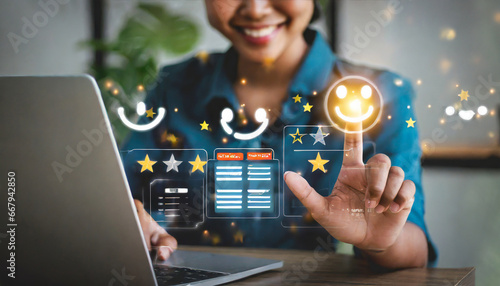 touching the virtual screen on the happy smiley face icon to give satisfaction in service. Rating very impressed. Customer service, testimonial satisfaction concep