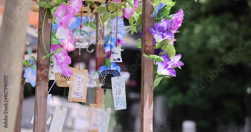 A wind chime swaying in summer day time photo