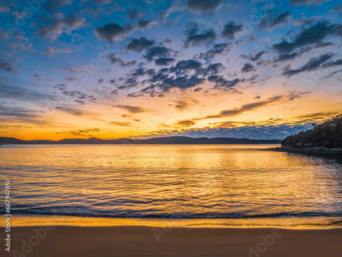 Aerial sunrise seascape with pretty cloud filled sky