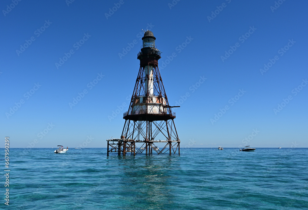 Fowey Rocks Lighthouse in Biscayne National Park, Florida on calm clear sunny autumn morning.