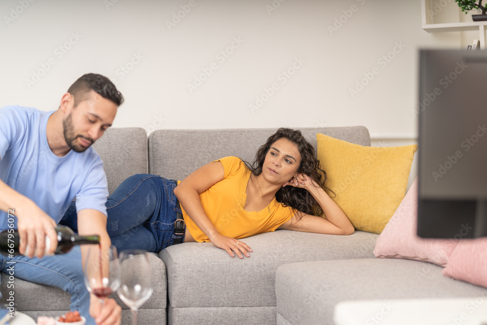 Couple drinking wine during a relaxed day at home