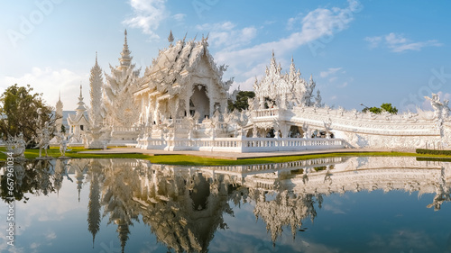 White temple Chiang Rai during sunset, view of Wat Rong Khun or White Temple Chiang Rai, Thailand photo