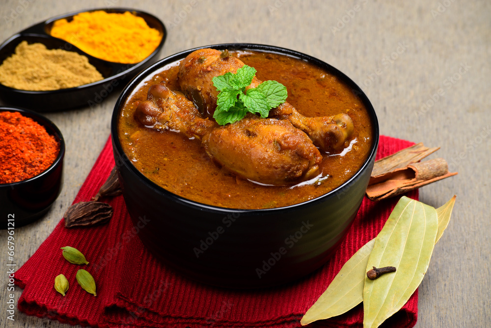 Indian style spicy chicken curry in bowl Indian style spicy chicken curry in bowl
