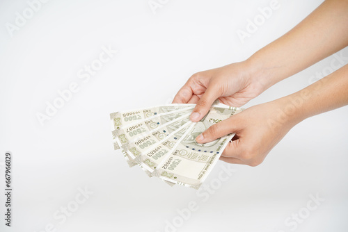 Cuadro en lienzo Indian rupees note in hand on white background