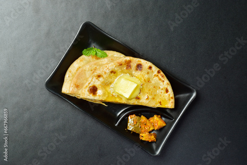 Top view of aloo paratha with mango aachar photo