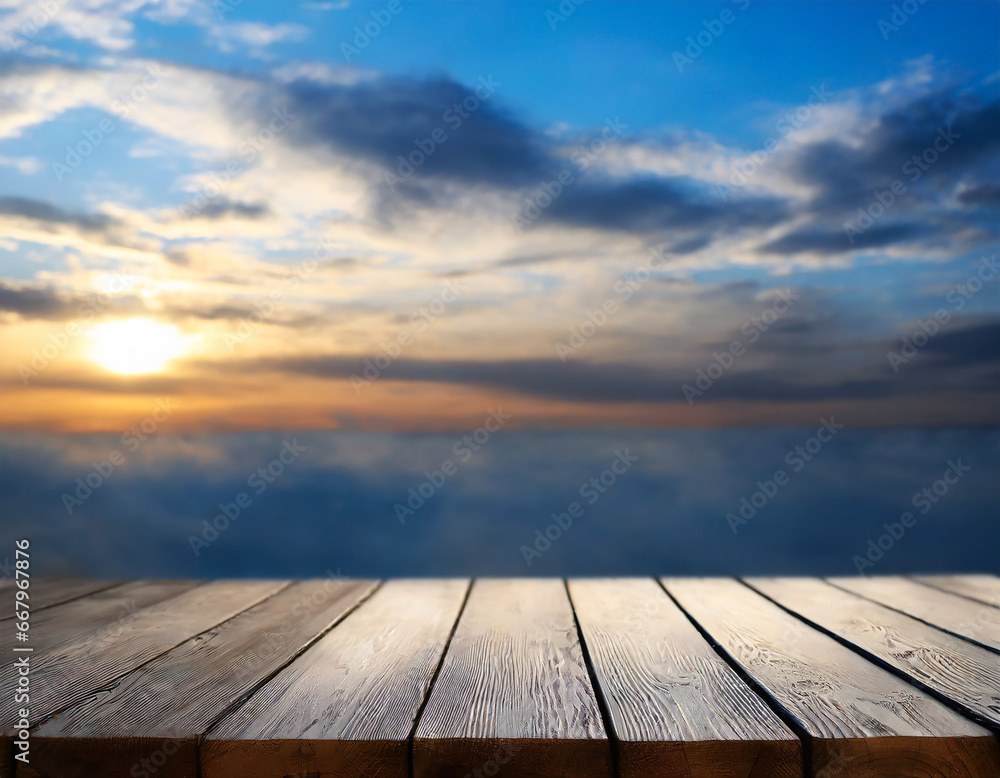 Empty wooden table against the backdrop of a blurred blue sky sunrise background. High quality photo