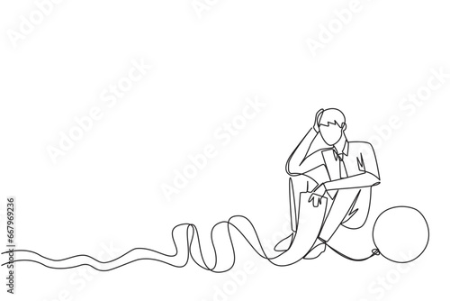Single continuous line drawing businessman sits on the floor and feet are chained by a steel ball while holding a billing paper. Fooled by loan sharks. Collapsed. One line design vector illustration