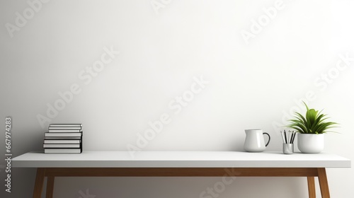 minimalistic desk background with books and coffee cup and pot of plant © Yash