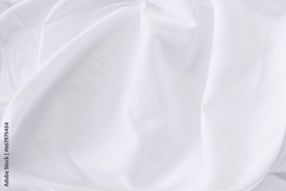 White fabric. luxurious white fabric texture background. Creases of satin, silk and cotton.