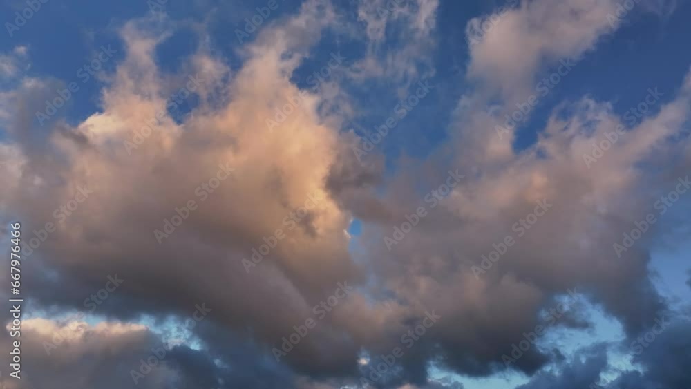 Aerial sunset clouds Kauai Hawaii evening pan 1. Beautiful fluffy clouds drifting over Hawaiian Islands in the Pacific Ocean. Sunset colors, shades of blue. Atmosphere meteorology weather nature. Aerial sunset clouds Kauai Hawaii evening pan 1. Beautiful fluffy clouds drifting over Hawaiian Islands in the Pacific Ocean. Sunset colors, shades of blue. Atmosphere meteorology weather nature.
