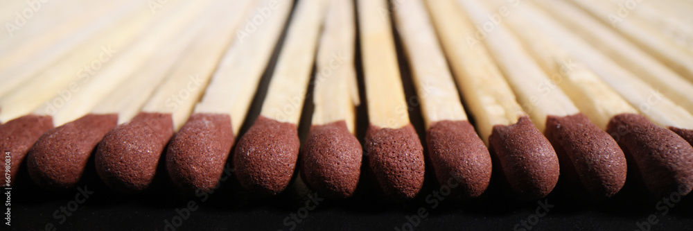 Matches with brown heads in long row ready for lighting up Matches with brown heads in long row ready for lighting up