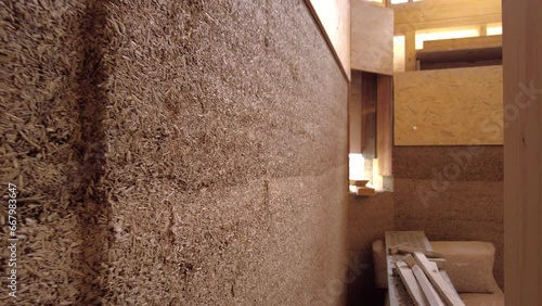 Close-up of hempcrete wall from the side passing by photo