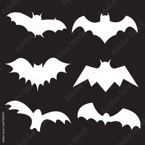 Black silhouettes of bats set on black background.