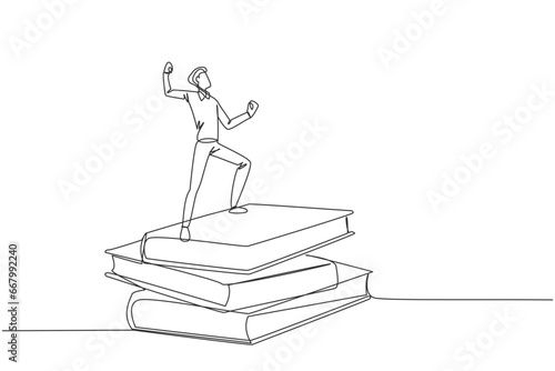 Single continuous line drawing of young businessman standing on stacks of giant books fist hands up. Reading improves his skills in business world to become a successful entrepreneur. One line design