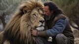 A man is next to a lion