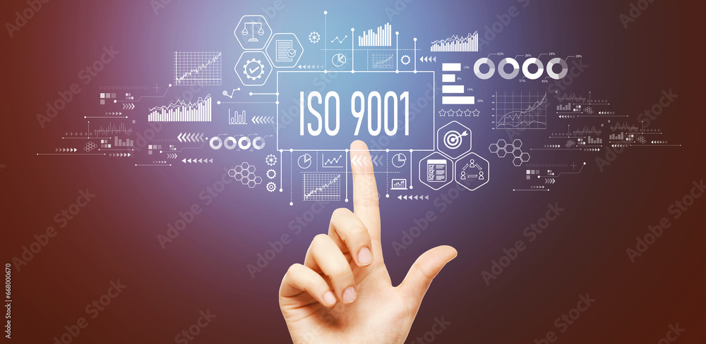ISO 9001 theme with hand pressing a button on a technology screen