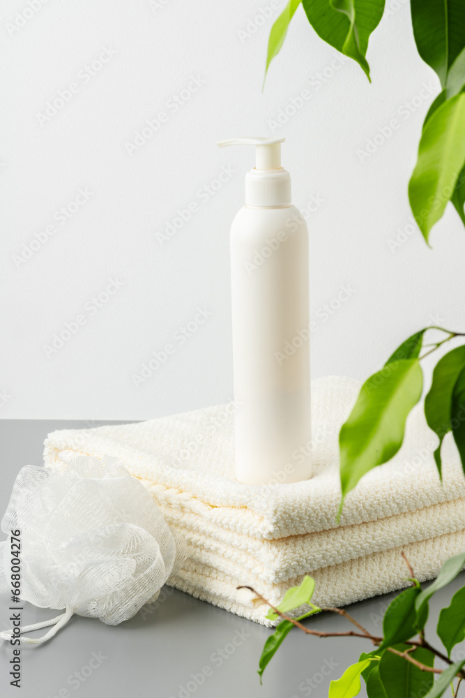 White cosmetics container mockup with towels on gray background White cosmetics container mockup with towels on gray background