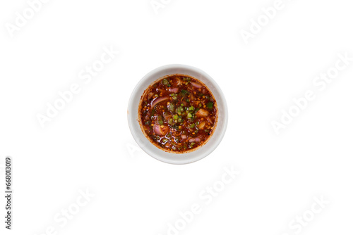 Fototapeta Naklejka Na Ścianę i Meble -  
Hot Jaew Sauce in a transparent cup Dipping sauce for dipping Thai food. Spicy, sour, spicy taste. Jaew dipping sauce. Image for menu design.