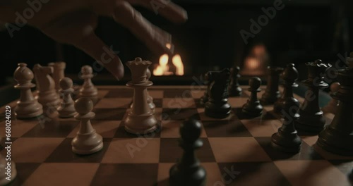 A chess game set in a fireplace atmosphere photo