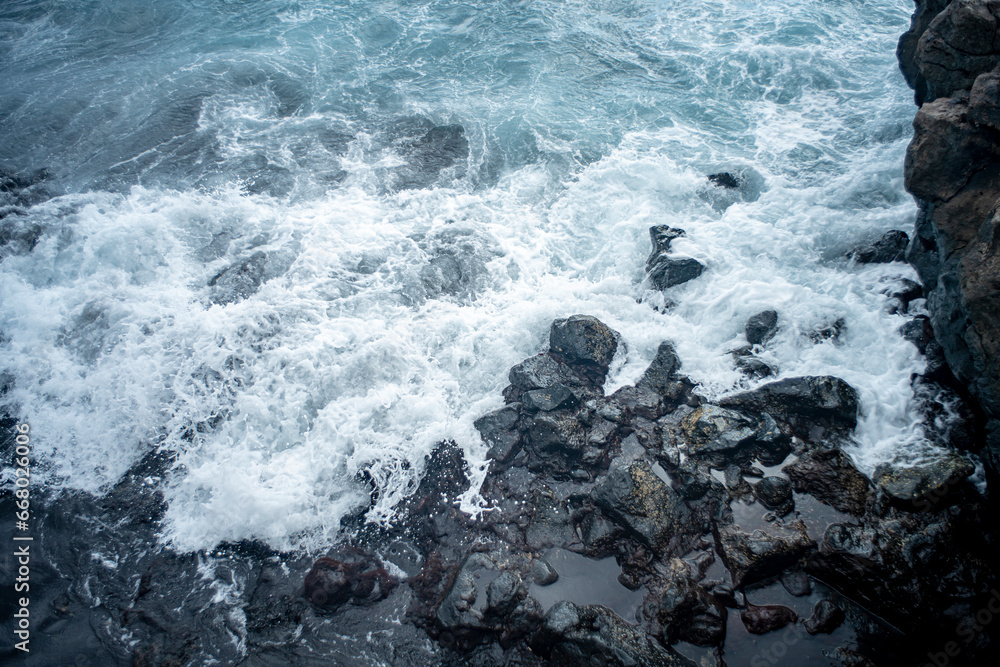 Stone coast of Tenerife, ocean, waves in Tenerife, stone beaches of Tenerife